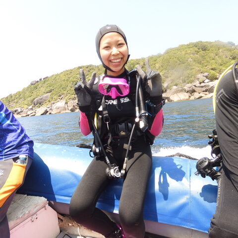 Divers smiling on the boat